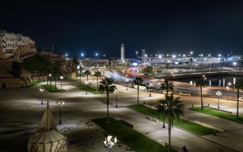 Seafront esplanade lit at night