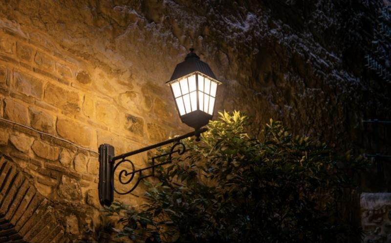 Wall lantern lighting a stone wall