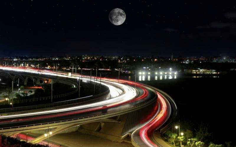 Road interchange lit at night